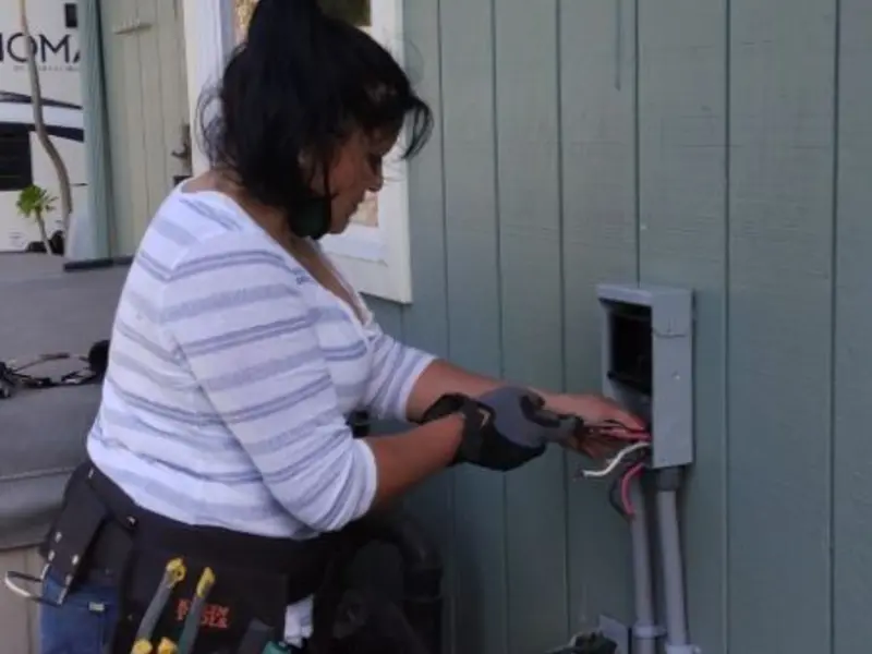Licensed electrician wiring an exterior subpanel in Humboldt